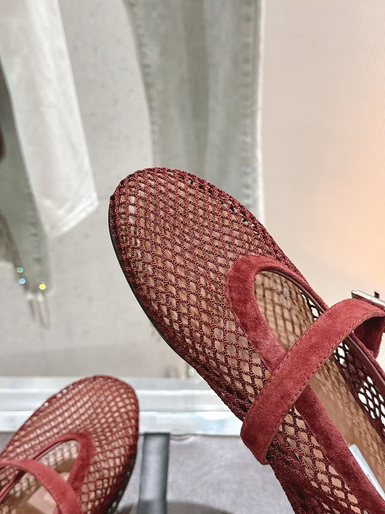 UA ALAÏA BALLET FLATS IN FISHNET