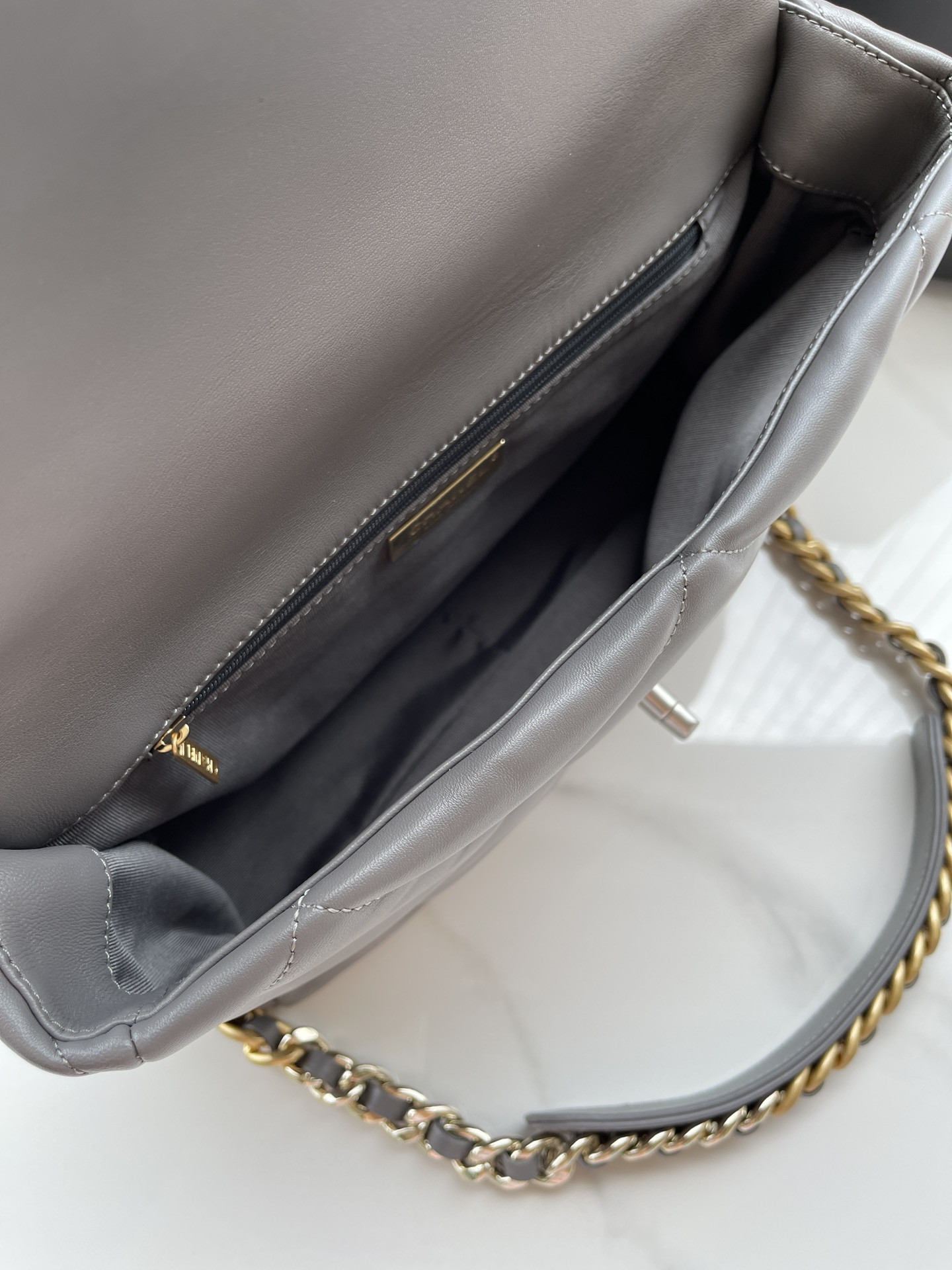 Ch*el 19 large handbag shiny leather, gold-tone, silver-tone & ruthenium-finish metal gray 7.8 × 11.7 × 3.9 in