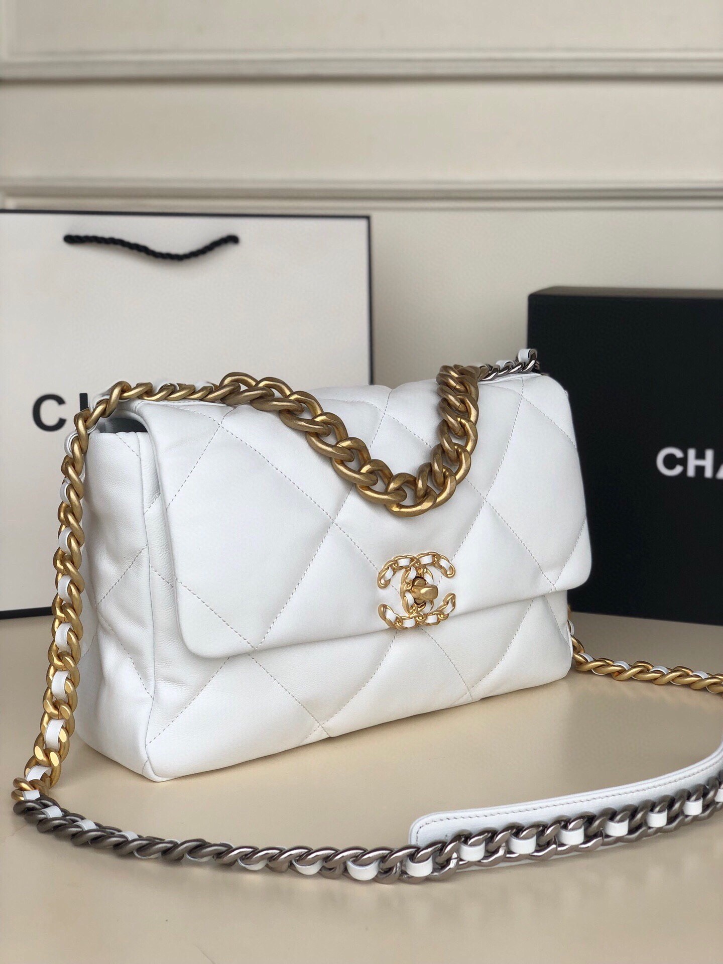 Ch*el 19 large handbag shiny leather, gold-tone, silver-tone & ruthenium-finish metal white 7.8 × 11.7 × 3.9 in